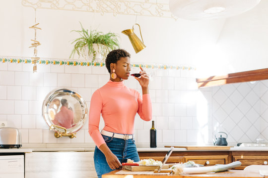 Black Woman Cooking In Kitchen