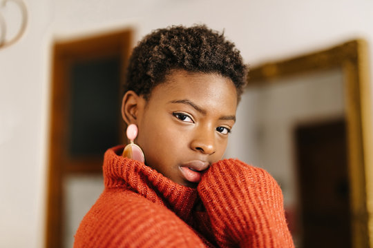 Sensual black woman in cozy sweater