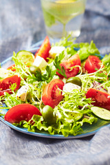 Salad with Green Olives, Tomatoes, Endive and Feta Cheese. 