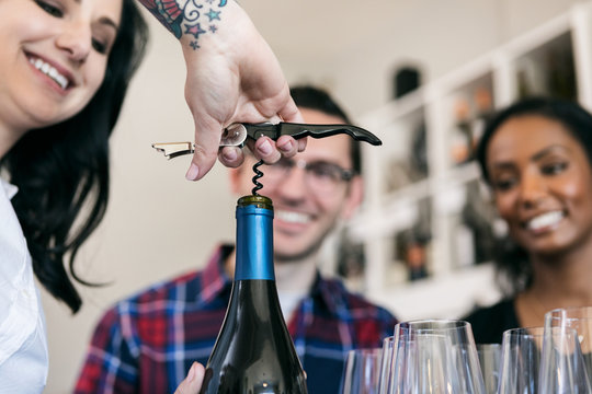 Wine: Woman Opens Bottle With Corkscrew For Tasting