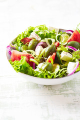 Fried hamburger steak with fresh salad. Wooden background. Close up. 