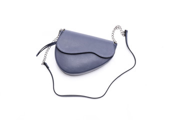 Luxury fashion women leather blue handbag isolated on a white background.