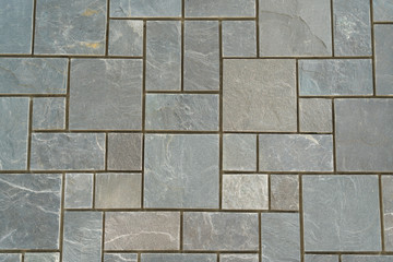 The texture of the wall is made of smooth stone blocks