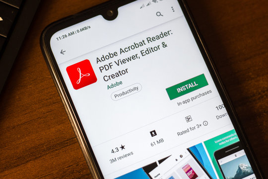 Ivanovsk, Russia - June 26, 2019: Adobe Acrobat Reader app on the display of smartphone.