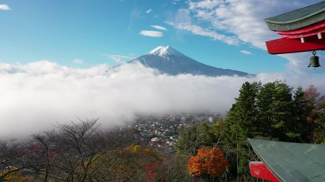 Aerial view 4k Video of Mount Fuji and mist view from behind Chureito Pagoda, Yamanashi, Japan.