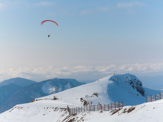 Mountain winter, paraglider