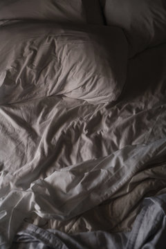 A Slept In Empty Bed In The Early Morning Light