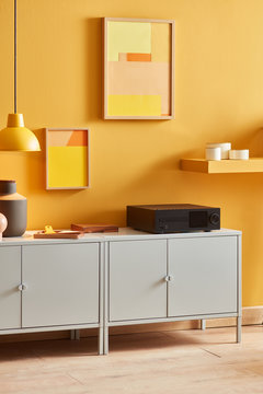 Contemporary interior with audio system on cabinet