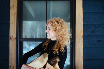 woman holding firewood