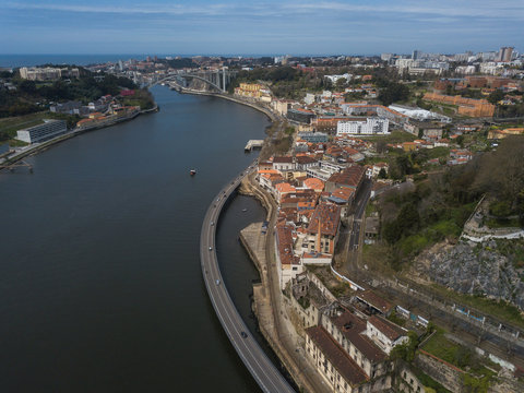 Aerial view of city with channel in bright sunlight
