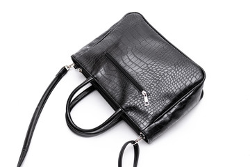 Luxury fashion women leather black handbag isolated on a white background.