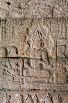 Carvings in the wall of temple in Cambodia