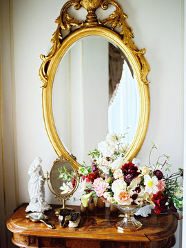 Dressing table with flower composition in classic interior