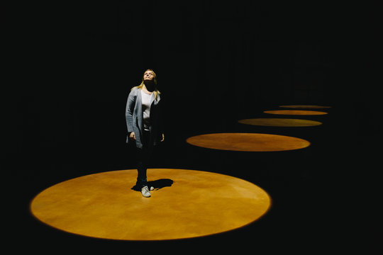 Young woman in spotlight