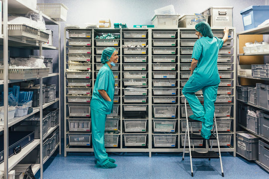 Nurses picking medicines from the warehouse boxes