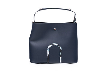 Luxury fashion women leather blue handbag isolated on a white background.