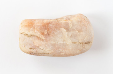 Mineral stone close-up isolated on a white background. A piece of granite or stone on a white background