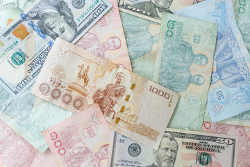 Close up Thai money note and dollars using as background stacking, Business concept