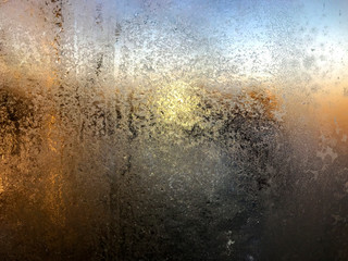 frost patterns on the window - frozen water vapor on the glass