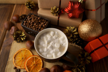 Obraz na płótnie Canvas Christmas holidays. Hot coffee with marshmallows and chestnuts. 