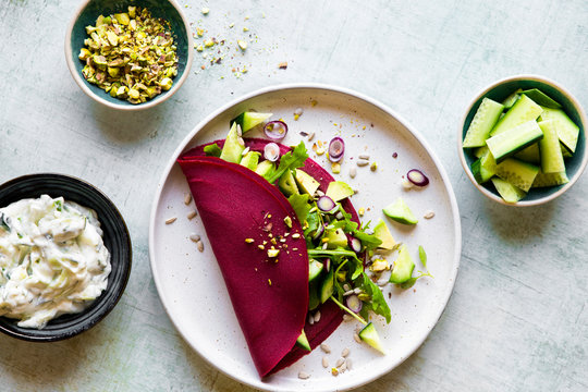 Buckwheat Beetroot Pancake Crepe with fresh cucumber and avocado