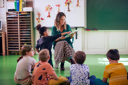Young teacher and her students in the classroom