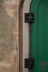 green door with hinges