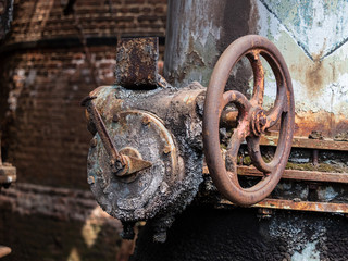 Rusty crank in the Völklingen Ironworks (Völklingen Hütte), in Germany. This abandoned steel...