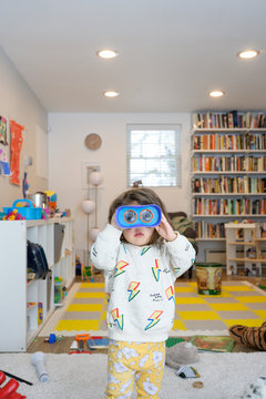 Little kid playing in playroom