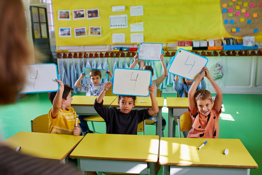 Young pupils and their teacher during a math class