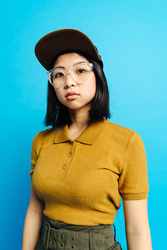 Young charming stylish lady in cap