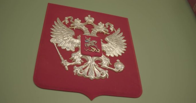 Golden double-headed eagle on a red background