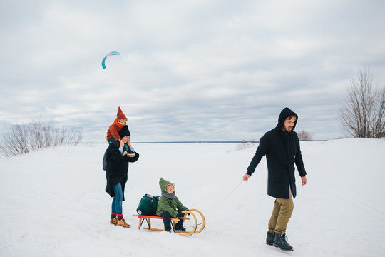 Family on frozen seacoast