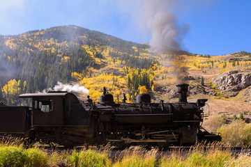 Fototapeta na wymiar Vintage Steam Train With Autumn Scenery Background.