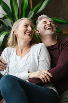 Couple enjoying time together in loft condo home.