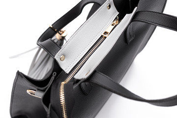 Luxury fashion women leather black handbag isolated on a white background.