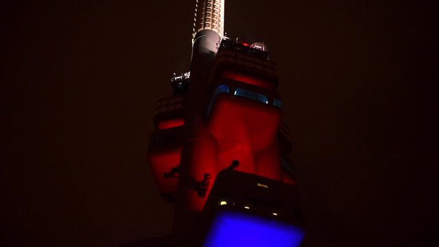 Close-up of a television tower at nigh