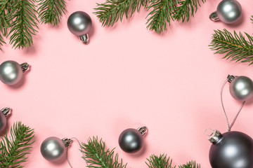 Christmas flat lay background on pink with present box and decorations.