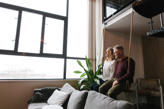 Couple enjoying time together in loft condo home.