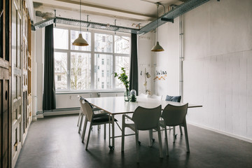 White Meeting Room with Vintage Door Wall Decoration