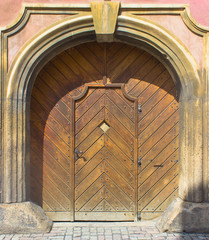Arched wooden doors