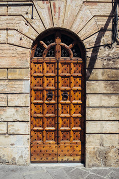 Traditional door with decorations of italian house