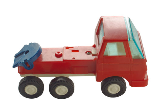 An image of an old toy truck without a trailer isolated on a white background