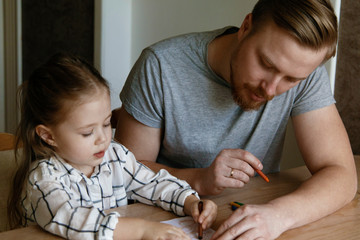 Cute father and daughter drawing