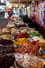 Raisins, dates and other candied fruits, sugar coated, for sale in a market.