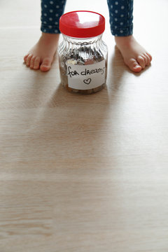For Dream moneybox and child on floor