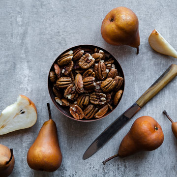 Bowl of pecan nuts and pears