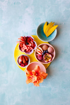 Pretty fruits arranged on pastel background