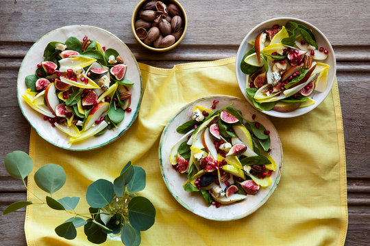 Summer salad of endive, spinach, pomegranate, pear, stilton cheese