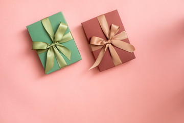 gift box with ribbon and bow isolated on pink